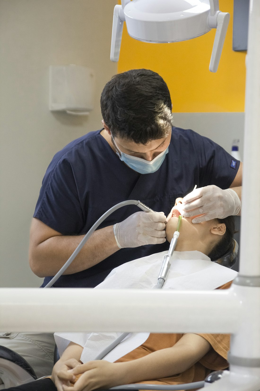 Dentist treating a patient chairside